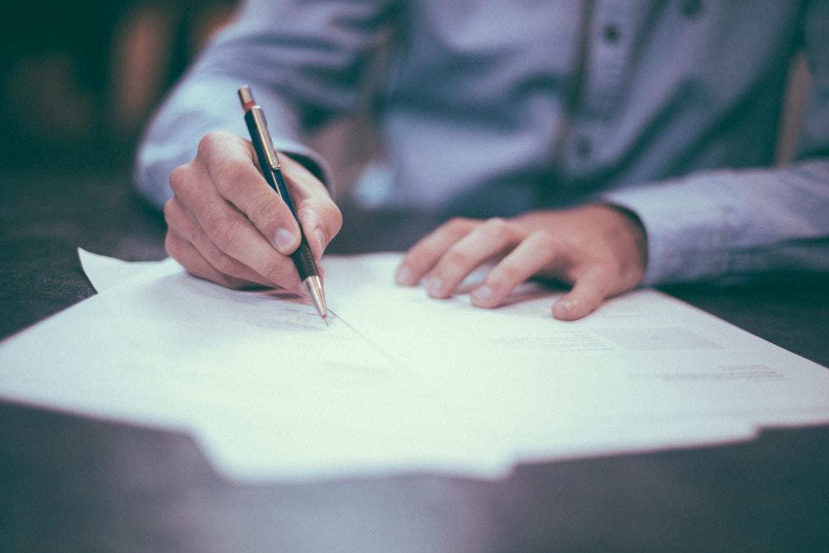 Legal and financial documents on a desk for corporate dispute analysis